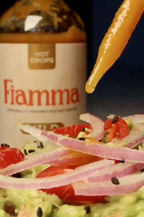 fiamma drops mild dropping onto avocado toast in slow motion from the glass dropper